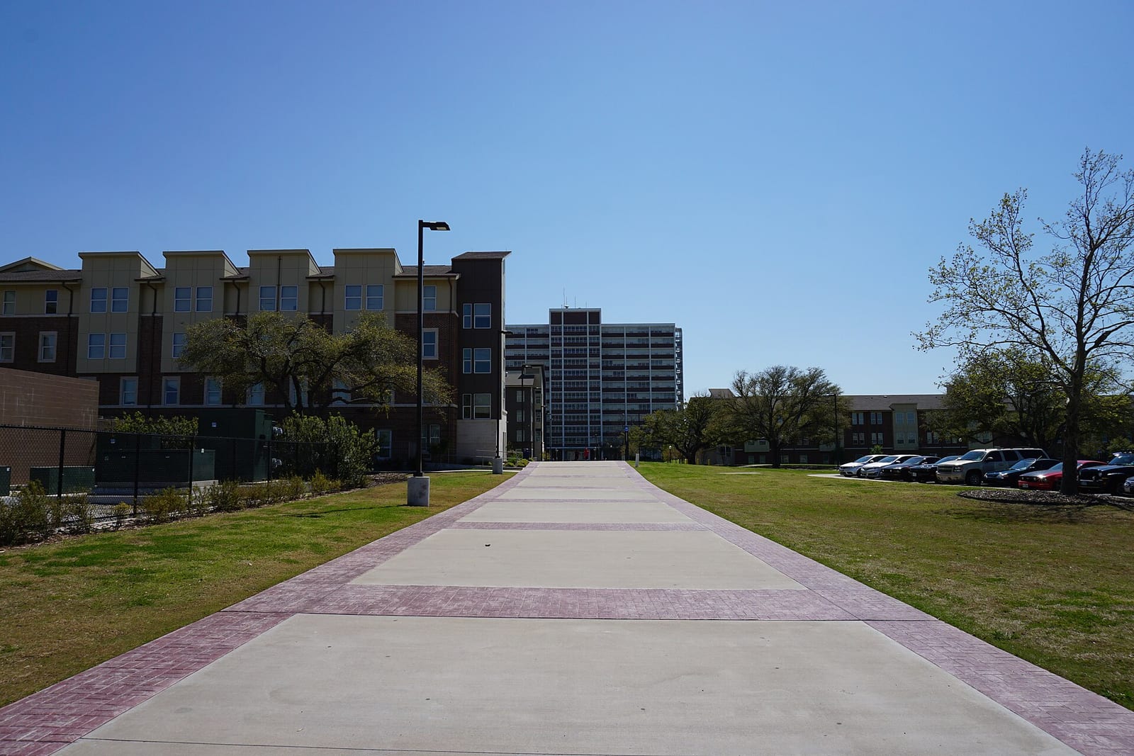 A walkway leading to campus residence halls